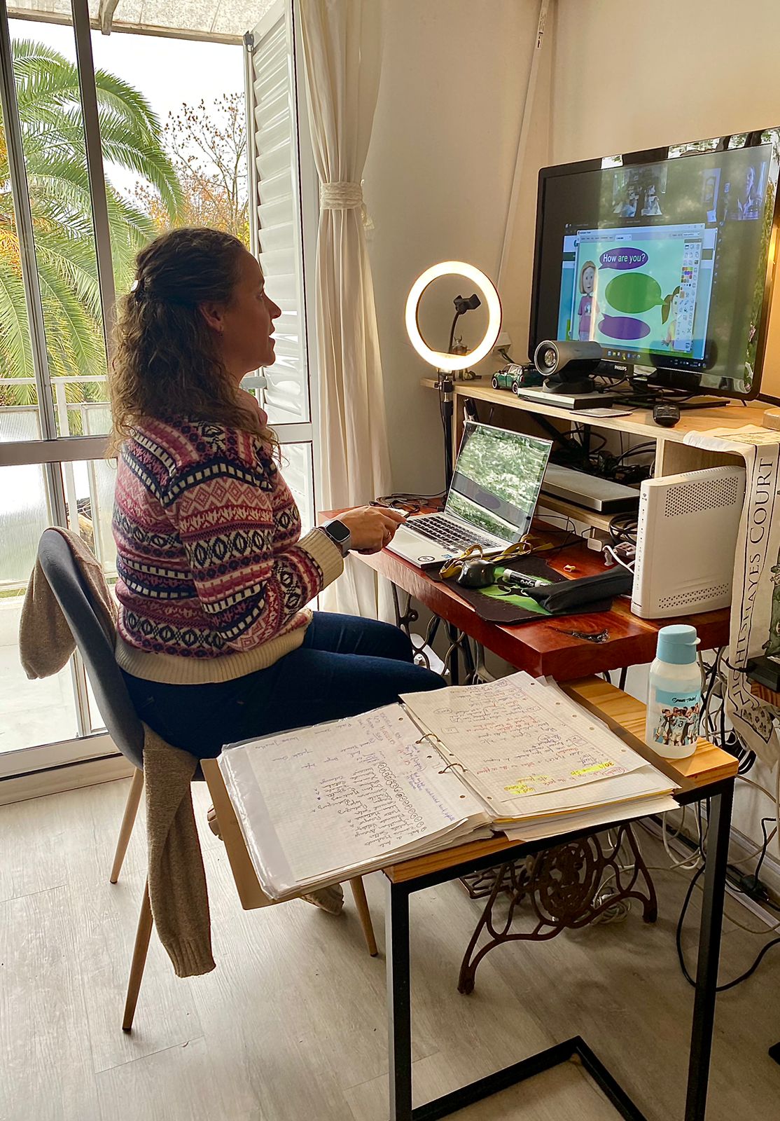 ELT trainer delivering a remote lesson from a home office